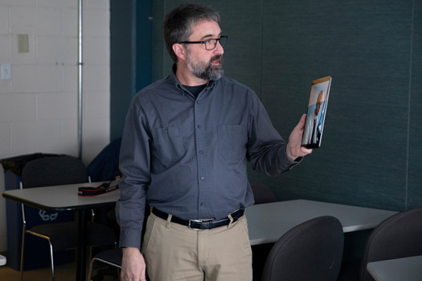 instructor                        lecturing to a remote student on an ipad